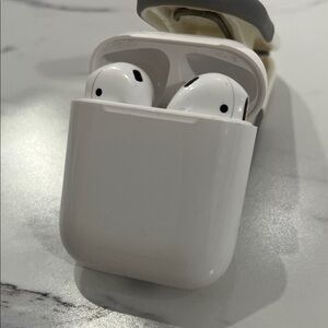 Apple AirPods with wireless charging case included